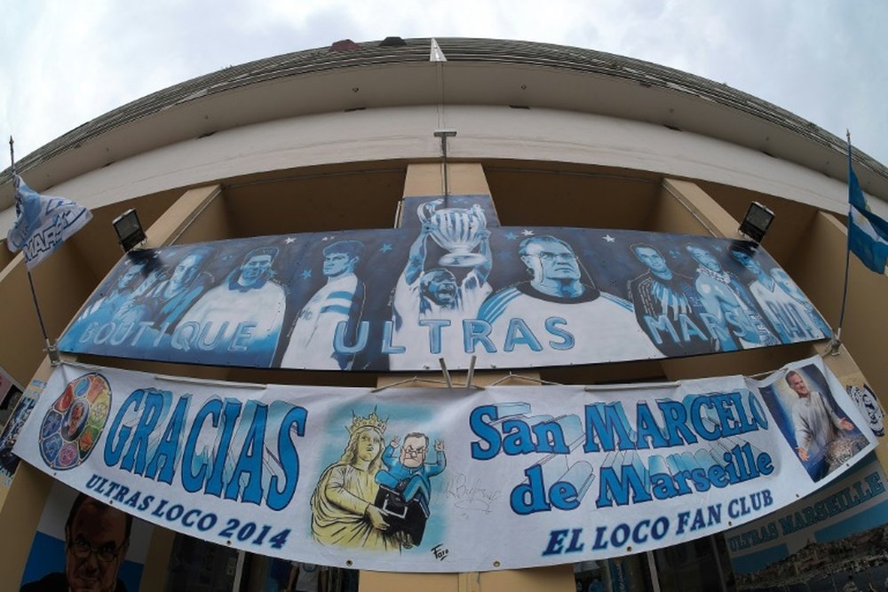 Banners picturing Marseilles former head coach Marcelo Bielsa are displayed outside a supporters club on August 10, 2015 in Marseille