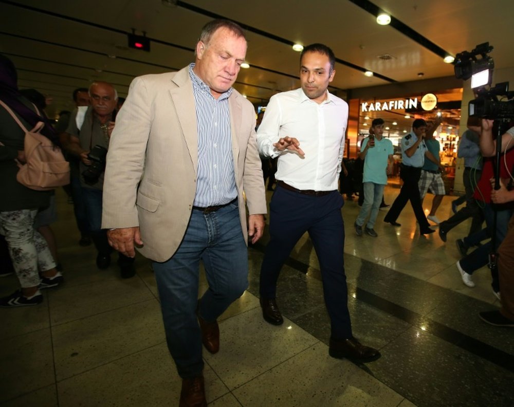 Netherlands coach Dick Advocaat (L) and Fenerbahce`s administrative manager Hasan Ãetinkaya speaking with one another following Advocaats arrival on August 15, 2016
