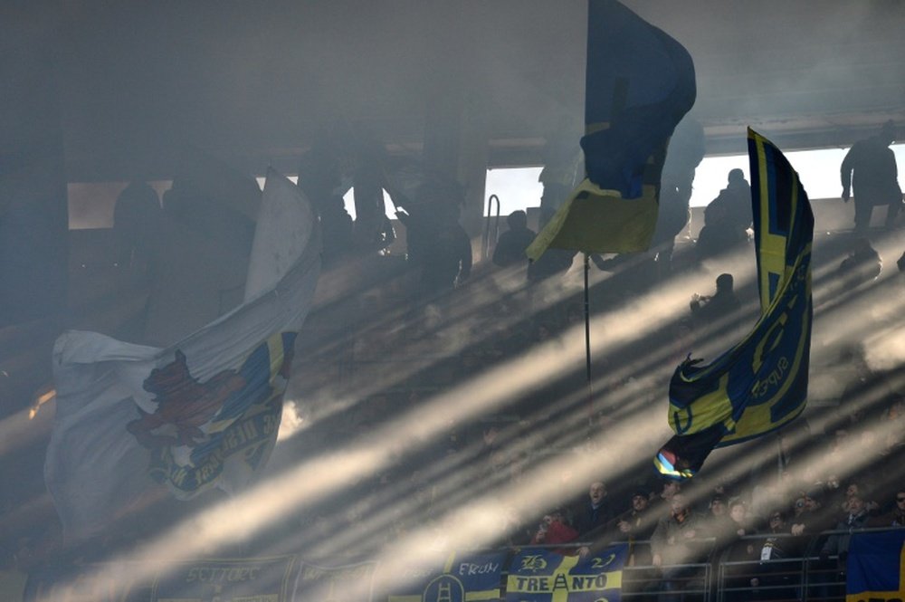 Hellas Verona supporters cheer in the stands during a Serie A football match in Verona on January 26, 2014