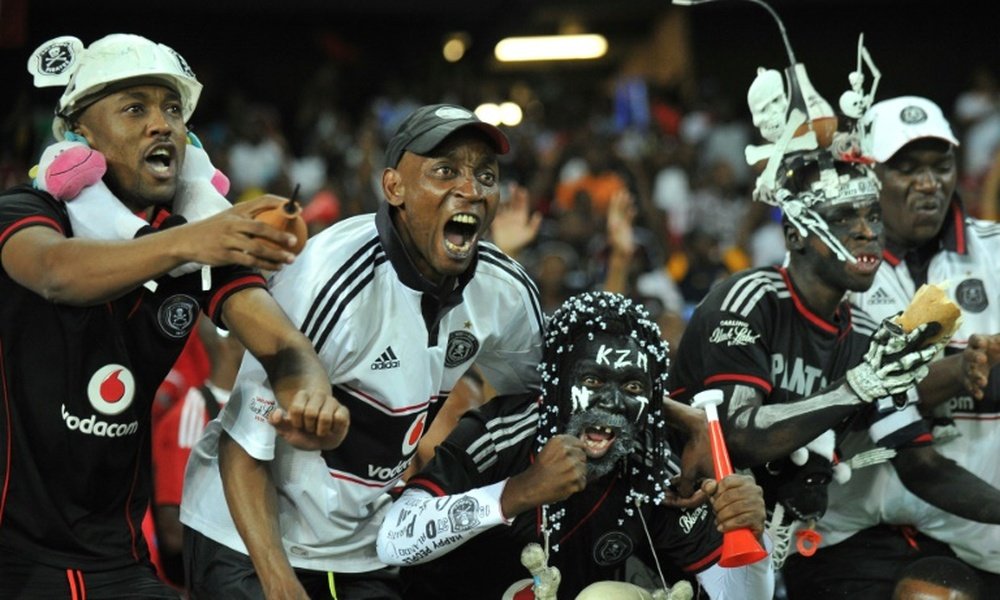 Orlando Pirates supporters celebrate on November 2, 2013