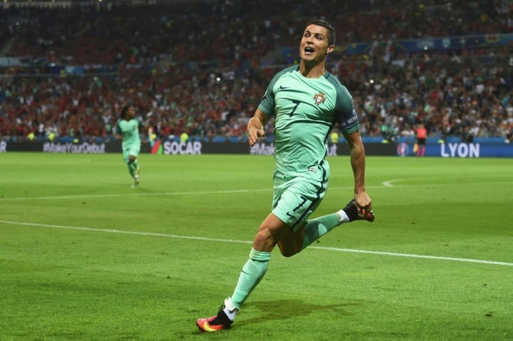 Portugals forward Cristiano Ronaldo celebrates after scoring a goal during the Euro 2016 match between Portugal and Wales on July 6, 2016