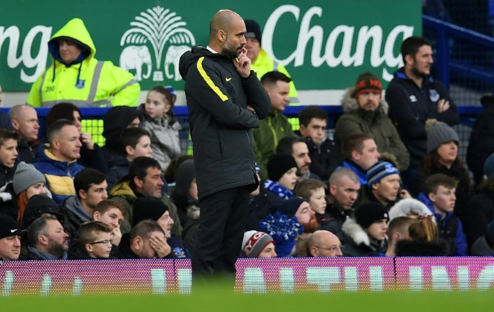 Guardiola watches on as his side lose 4-0 at Everton. AFP