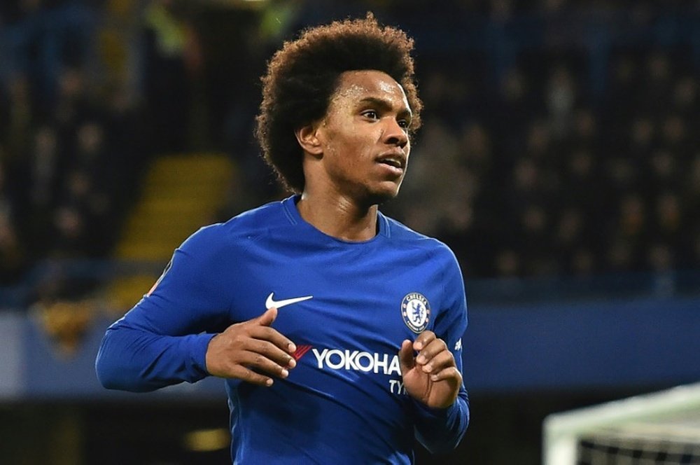 Willian insists he never wanted to leave the 'Blues'. AFP