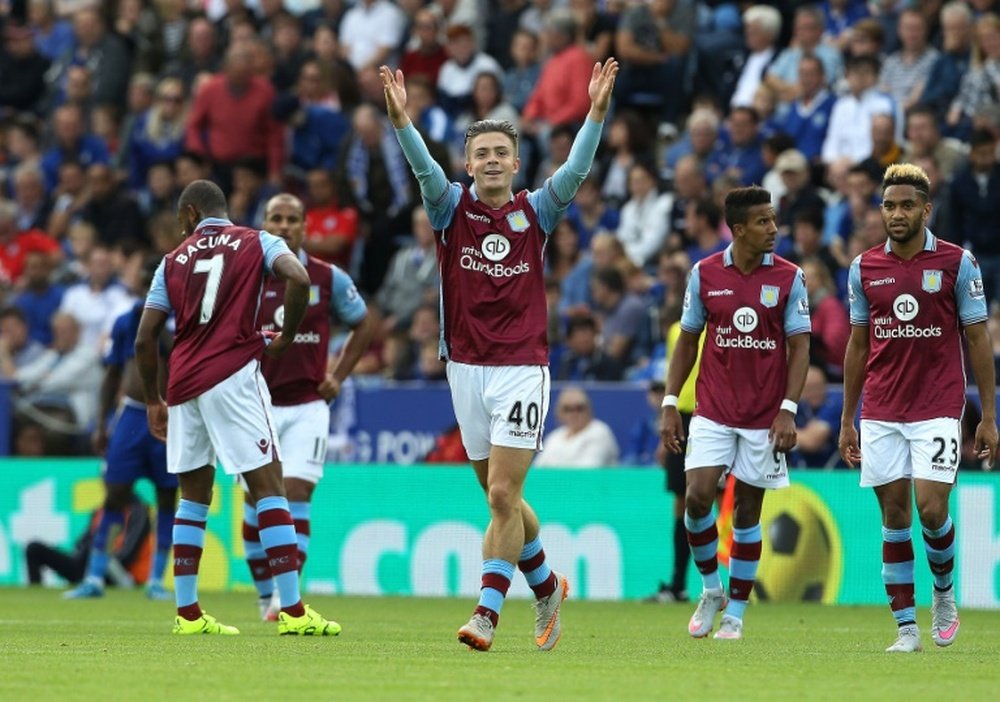 Aston Villas English midfielder Jack Grealish (centre) celebrates after scoring the opening goal of the English Premier League match between Leicester City and Aston Villa at King Power Stadium in Leicester on September 13, 2015