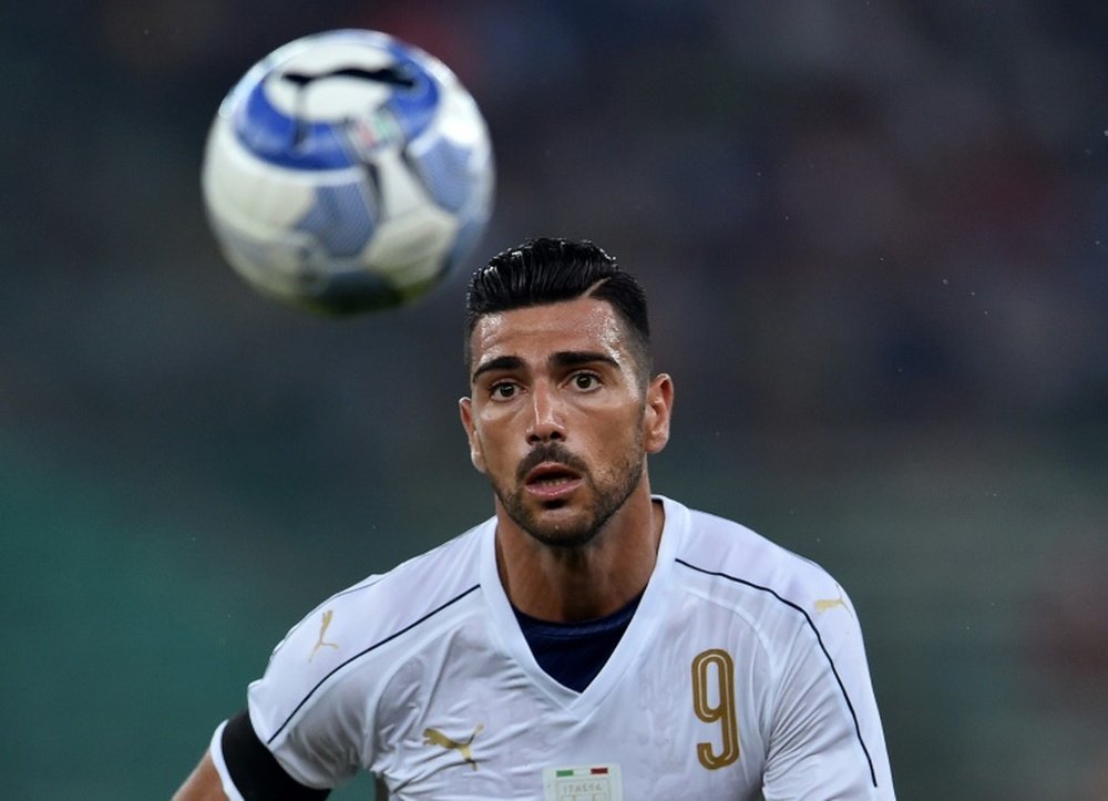 Italy's Graziano Pelle eyes the ball . AFP