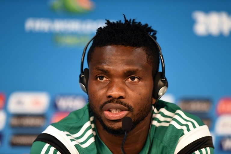 Nigerias defender Joseph Yobo answers a question during a press conference before a training session at the Pantanal Arena in Cuiaba, Brazil on June 20, 2014