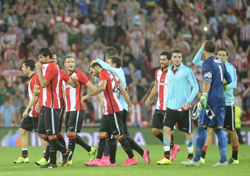Athletic Bilbaos players celebrate after winning their Spanish Supercup first-leg football match against FC Barcelona in Bilbao, Spain, on August 14, 2015
