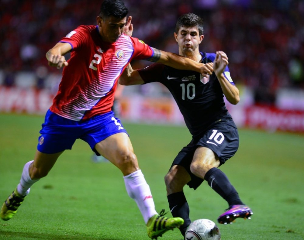 Christian Pulisic (right) challenges Costa Rica's Johnny Acosta in San Jose on November 15, 2016