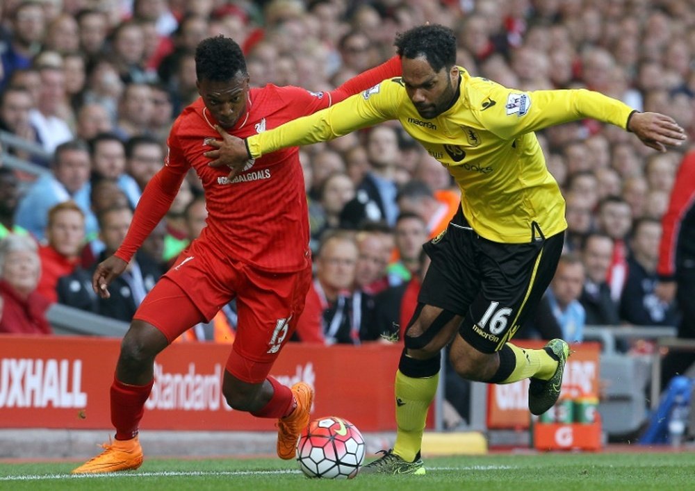 Aston Villas Joleon Lescott (R) vies for the ball with Liverpools Daniel Sturridge during the English Premier League football match at the Anfield stadium in Liverpool, England on September 26, 2015