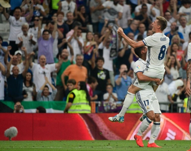 Real Madrids German midfielder Toni Kroos celebrates after scoring during the Spanish league football match Real Madrid CF vs RC Celta de Vigo at the Santiago Bernabeu stadium in Madrid on August 27, 2016