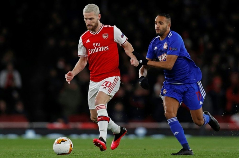 Mustafi (L) is more interested in football resuming than his Arsenal future. AFP