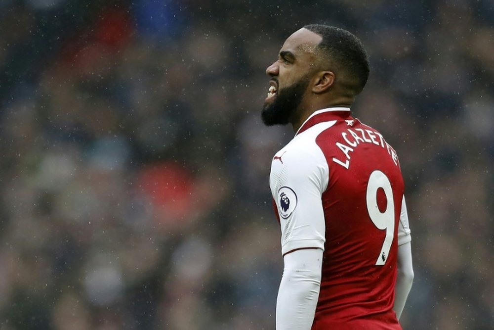 Wenger says his decision to frequently sub Lacazette is largely down to his position. AFP