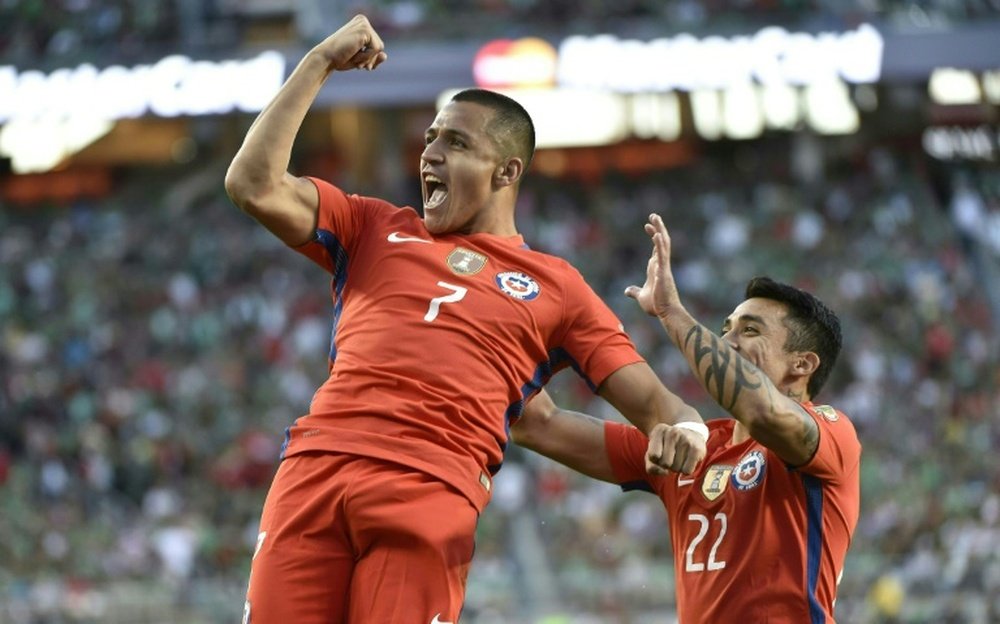 Sanchez (L) celebrates scoring for Chile