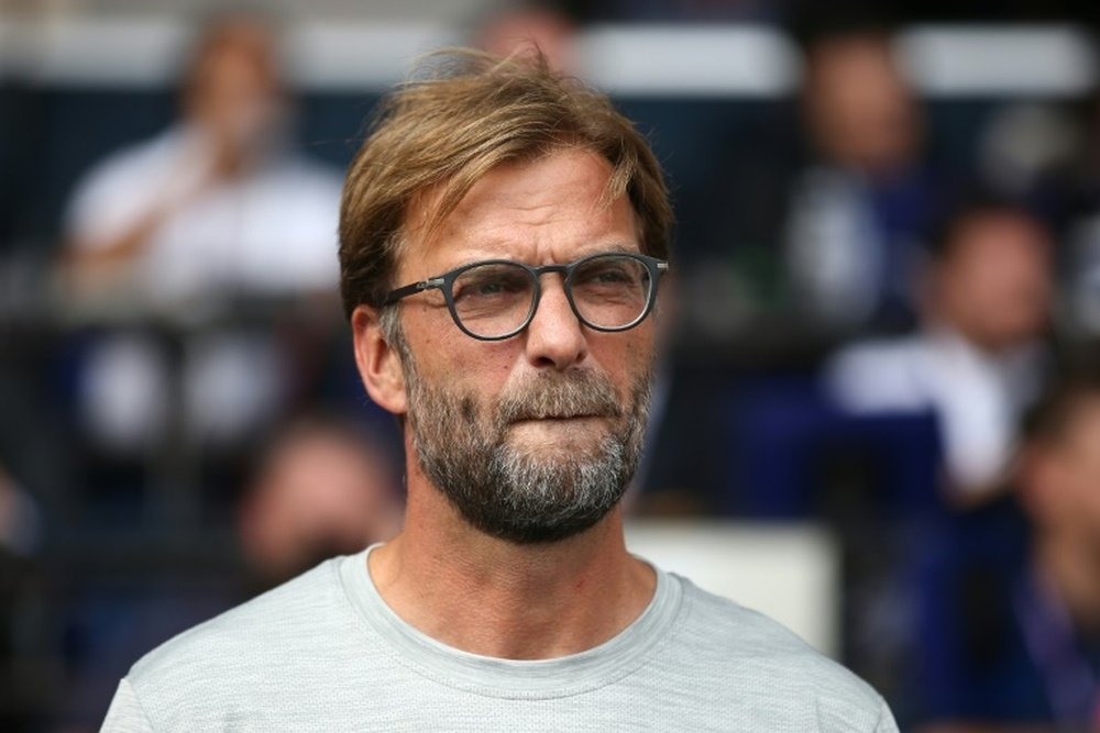 Jurgen Klopp talking about private stuff. AFP