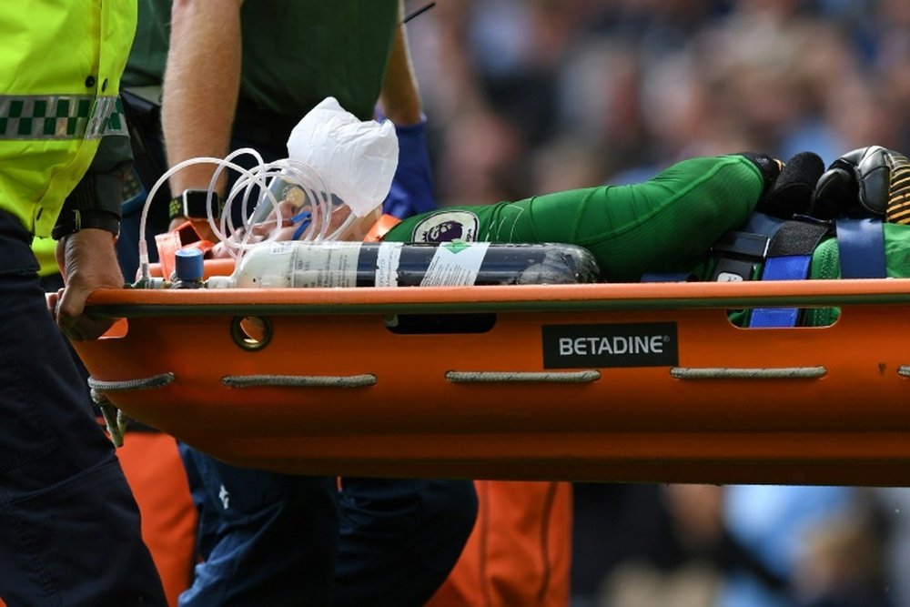Ederson had to be taken off on a stretcher after the Mane challenge. AFP