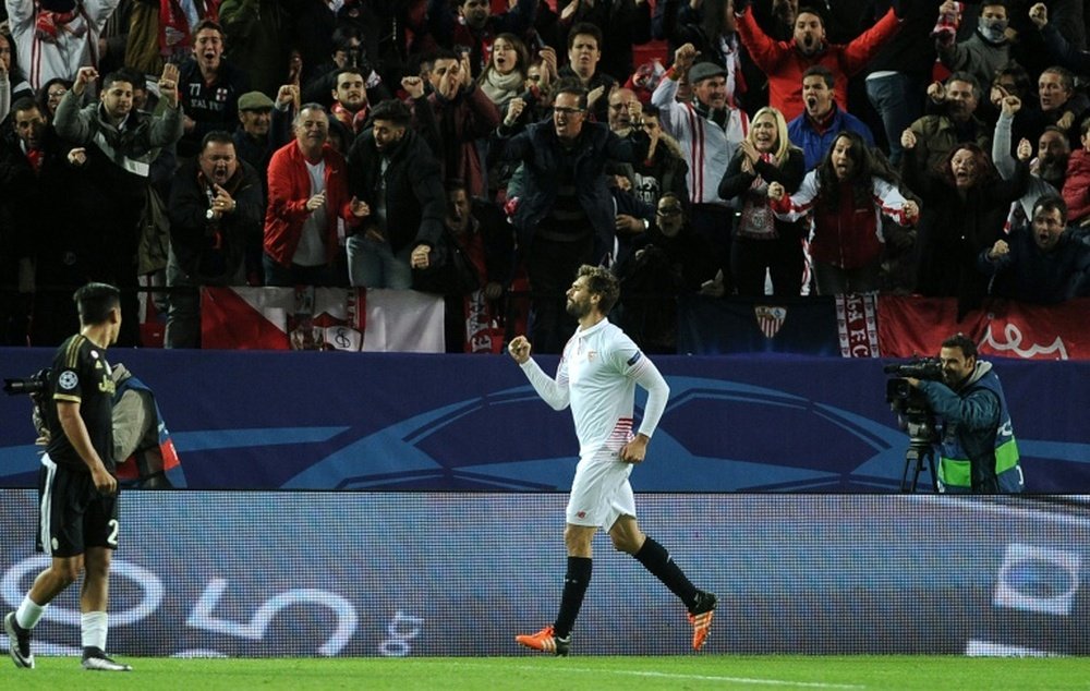 Sevillas Spanish forward Fernando Llorente celebrates after scoring a goal during the UEFA Champions League Group D football match Sevilla FC vs Juventus at the Ramon Sanchez Pizjuan stadium in Sevilla on December 8, 2015