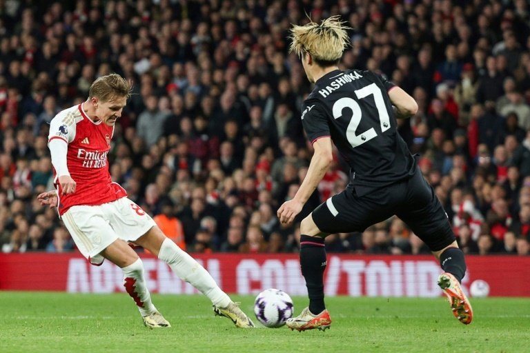 The Gunners claimed a comfortable win over the Hatters. AFP