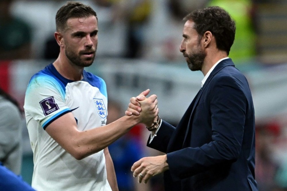 Southgate (R) will not be deterred from playing Jordan Henderson. AFP