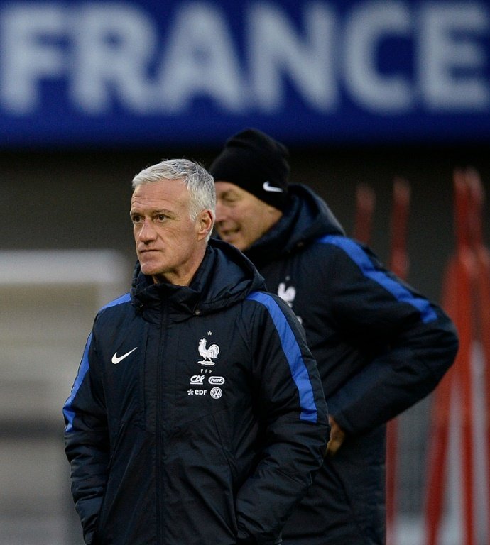 Frances head coach Didier Deschamps looks at his players during a training session in Clairefontaine en Yvelines on March 21, 2016 on the first day of their training ahead of the friendly football match against Netherland to be held on March 25