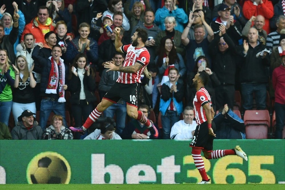 Austin swept home from Nathan Redmond's cross. AFP