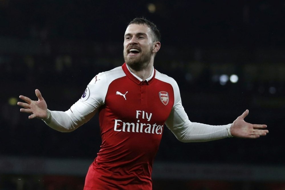 Ramsey celebrates scoring against Everton last season. AFP