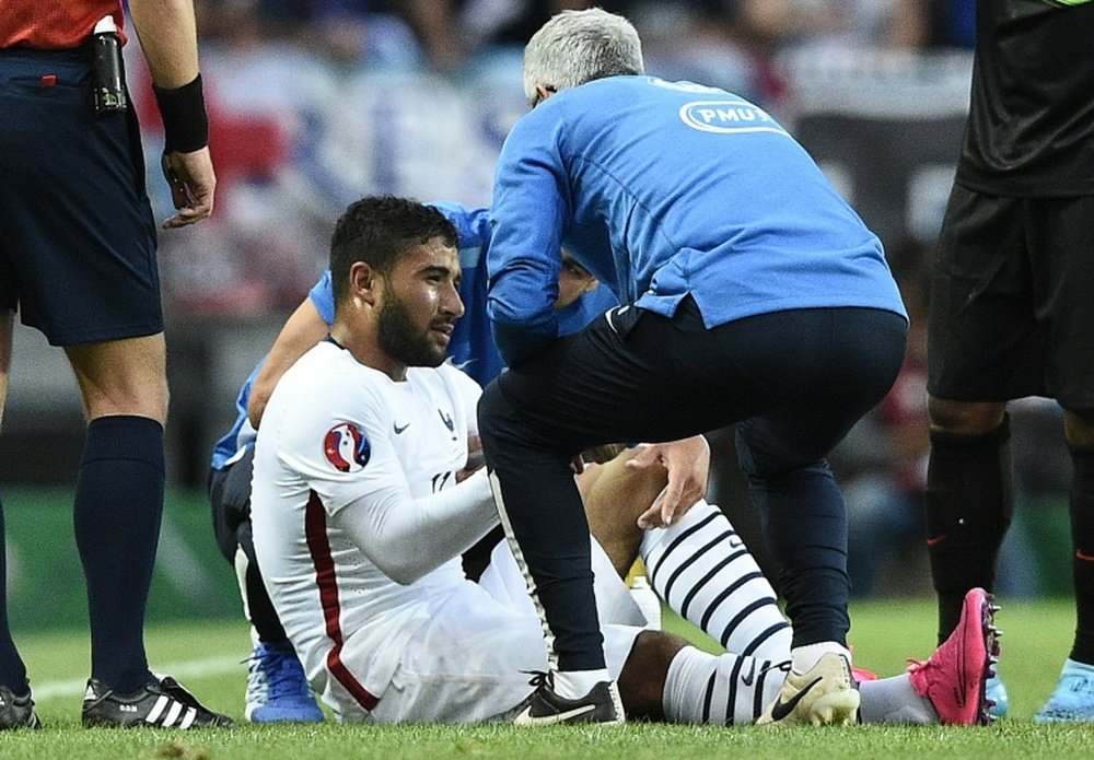 Frances forward Nabil Fekir reacts to an injury during their Euro 2016 friendly match against Portugal at the Jose Alvalade stadium in Lisbon on September 4, 2015