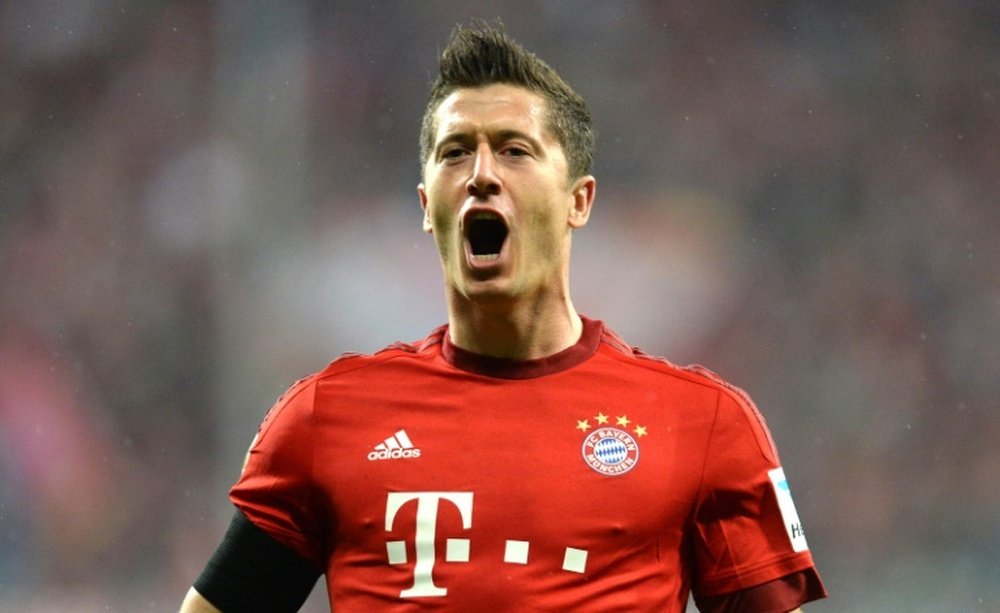 Bayern Munichs Polish striker Robert Lewandowski celebrates after the third goal for Munich during the German first division Bundesliga football match FC Bayern Muenchen vs VfL Wolfsburg in Munich, on September 22, 2015