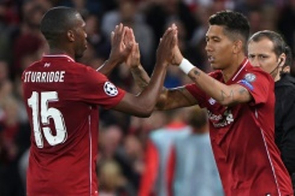 Liverpool forward Roberto Firmino (right) replaces Daniel Sturridge during the Champions League match against Paris Saint-Germain