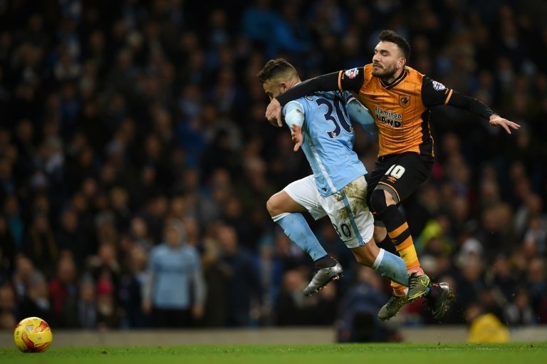 Hull City's midfielder Robert Snodgrass (R) vies with Manchester City's defender Nicolas Otamendi (L) during the English League Cup quarter-final football match in Manchester, England on December 1, 2015