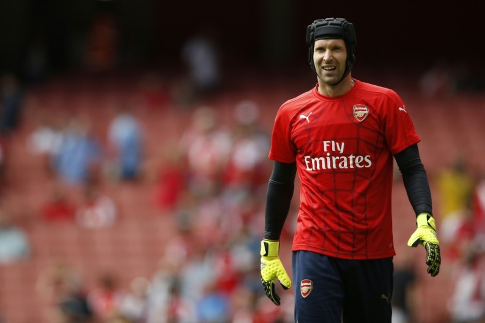 Arsenals Czech goalkeeper Petr Cech warms up before the start of their English Premier League football match against West Ham United at the Emirates Stadium in London on August 9, 2015