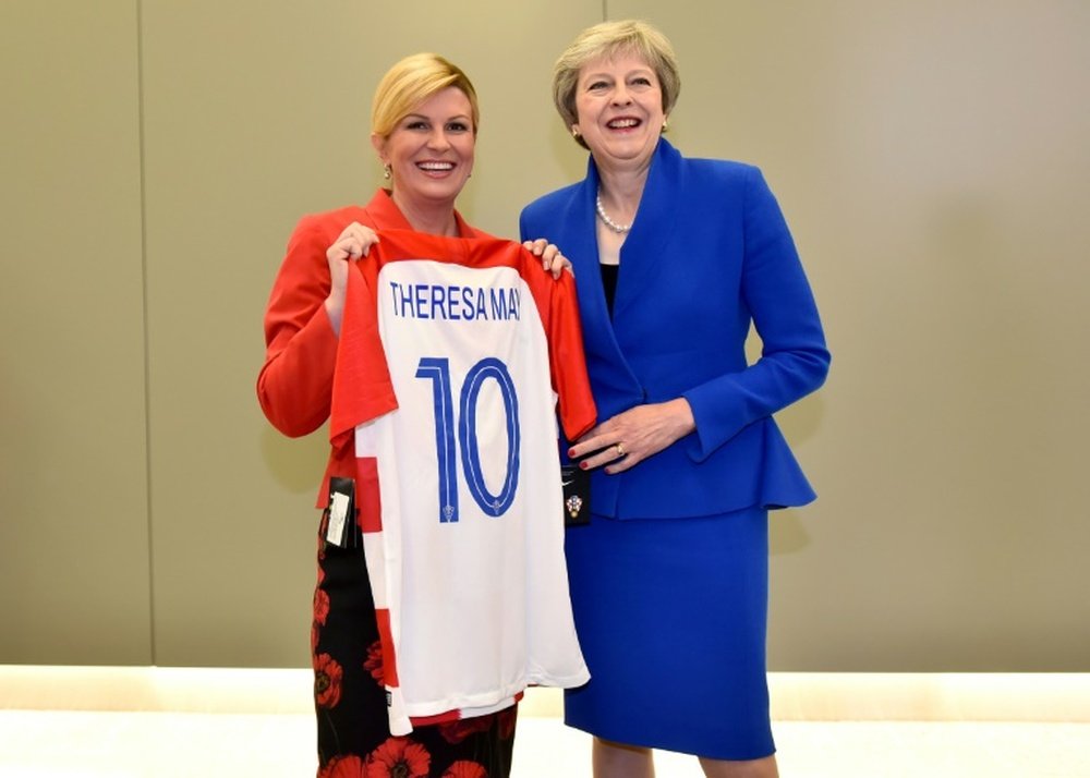 The Croatia president presented May with a Croatia shirt. AFP