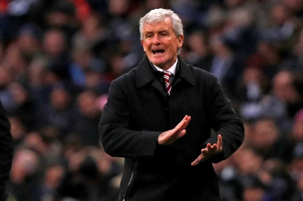 Mark Hughes, pictured here in December 2017, was axed three hours after the game. AFP