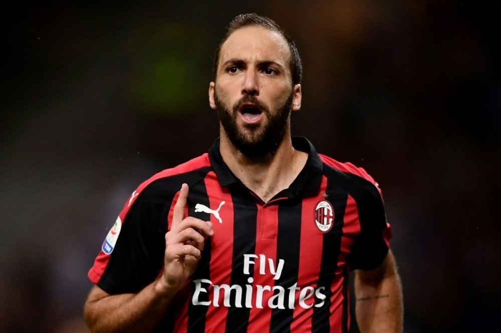 Gonzalo Higuain scored twice as Milan beat Chievo 3-1. AFP