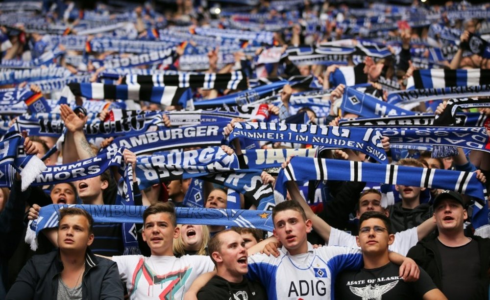 Fans of Hamburg cheer while watching a match in Hamburg, northern Germany on May 18, 2014