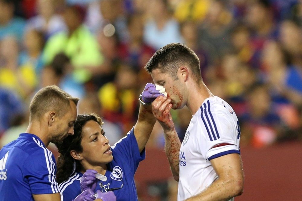 Gary Cahill of Chelsea is tended to by medical staff after scoring a goal against Barcelona during their International Champions Cup match on July 28, 2015 in Landover, Maryland