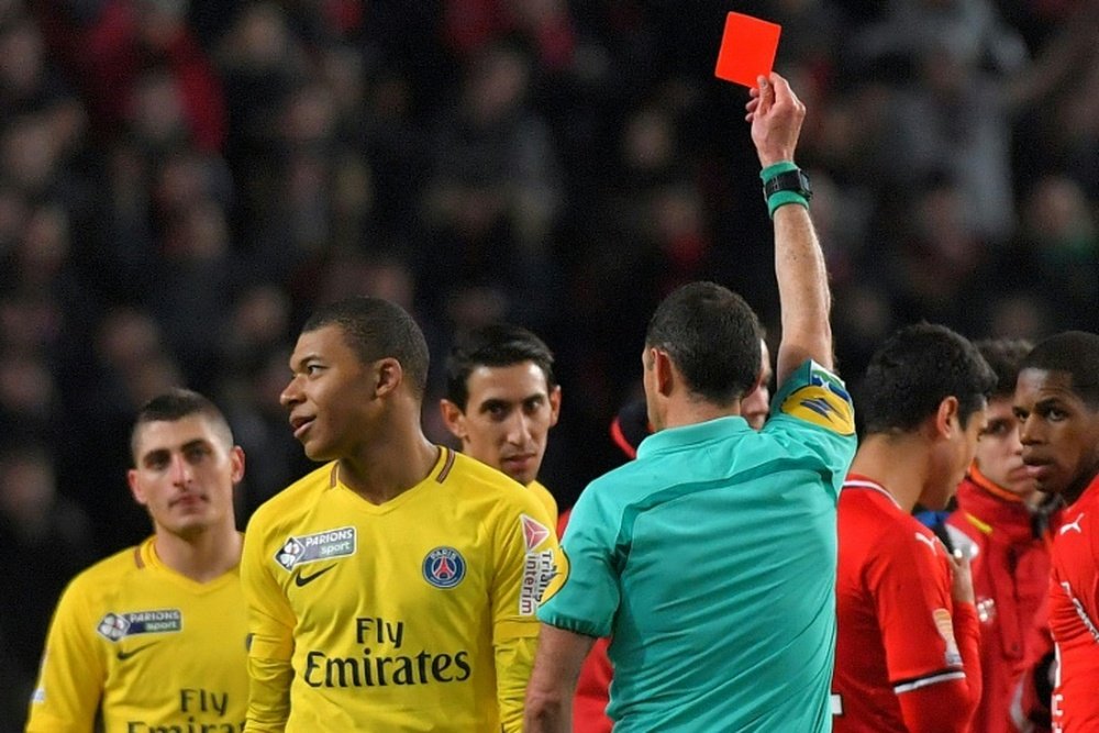 PSG emerged victorious despite Mbappe's red card. AFP