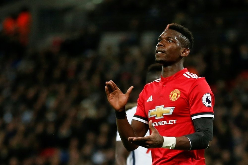 Pogba has reportedly demanded to play futrther forward. AFP