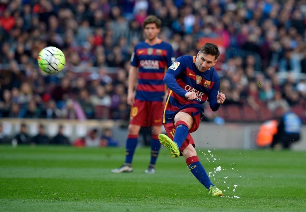 Barcelonas forward Lionel Messi kicks the ball during a Spanish league football match against Getafe at the Camp Nou stadium in Barcelona on March 12, 2016