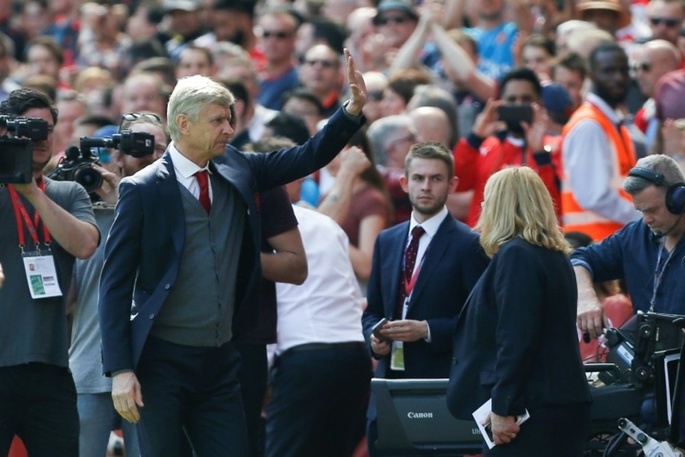 Wenger is tipped for a club job in Europe next season. AFP