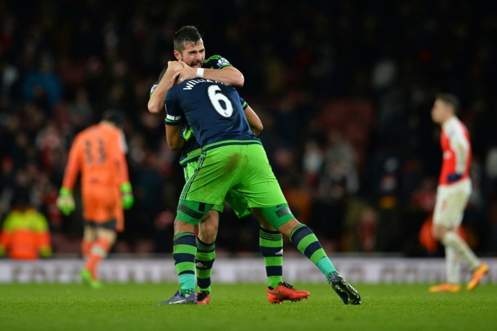 Swansea Citys defender Ashley Williams (front) celebrates scoring a goal with defender Jordi Amat during the English Premier League football match between Arsenal and Swansea City in London on March 2, 2016