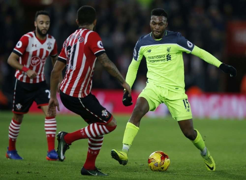 Liverpool's Daniel Sturridge vies with Southampton's Nathan Redmond in the first leg. AFP