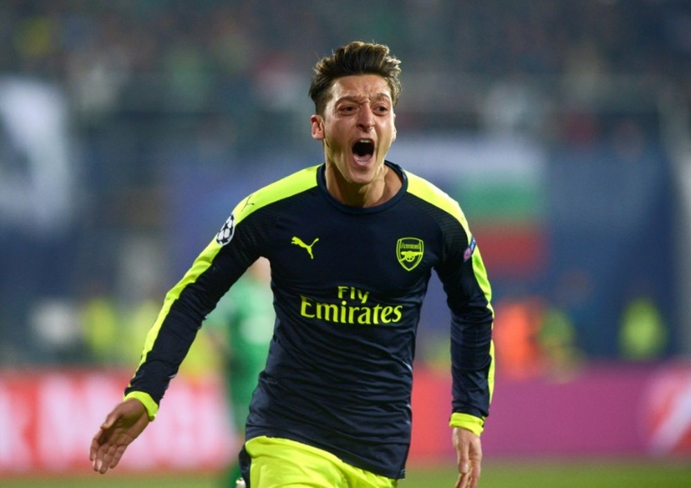 Ozil is close to signing a new contract with the Gunners. AFP