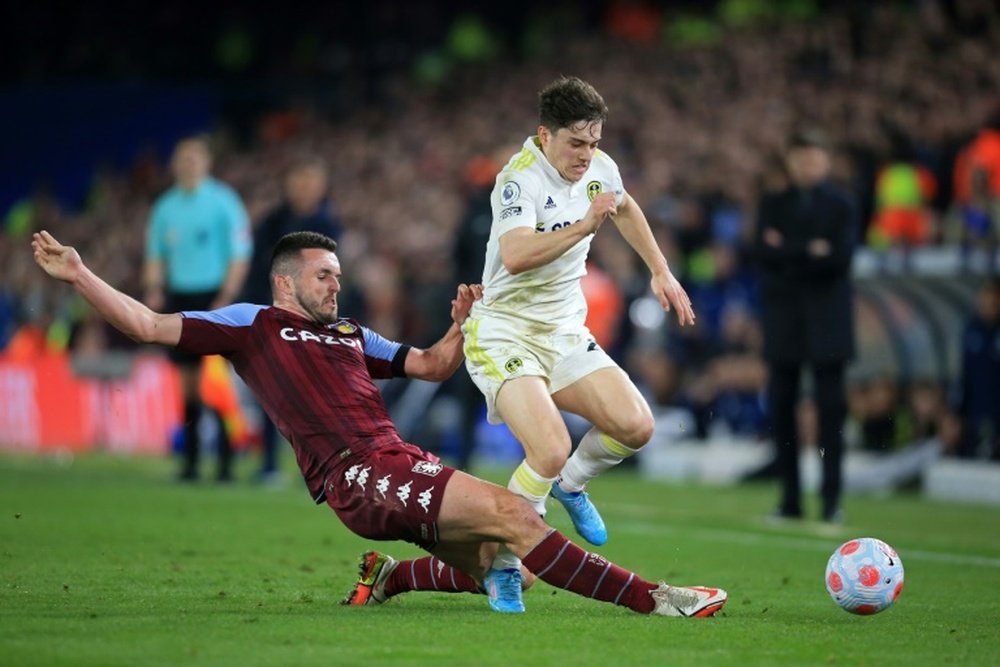 Tottenham want to get John McGinn (L). AFP