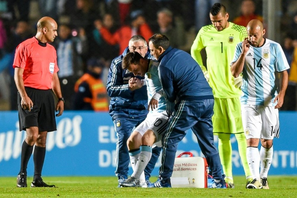 Argentinas Lionel Messi required treatment on the field for several minutes before being swiftly substituted during a friendly match against Honduras