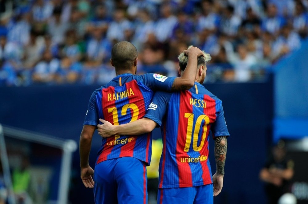 Barcelona players Rafinha (L) and Lionel Messi celebrate a goal. AFP
