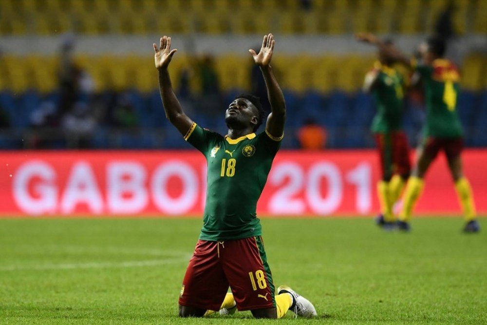 Cameroon's Robert Ndip Tambe celebrates at the end of their match against Guinea-Bissau. AFP