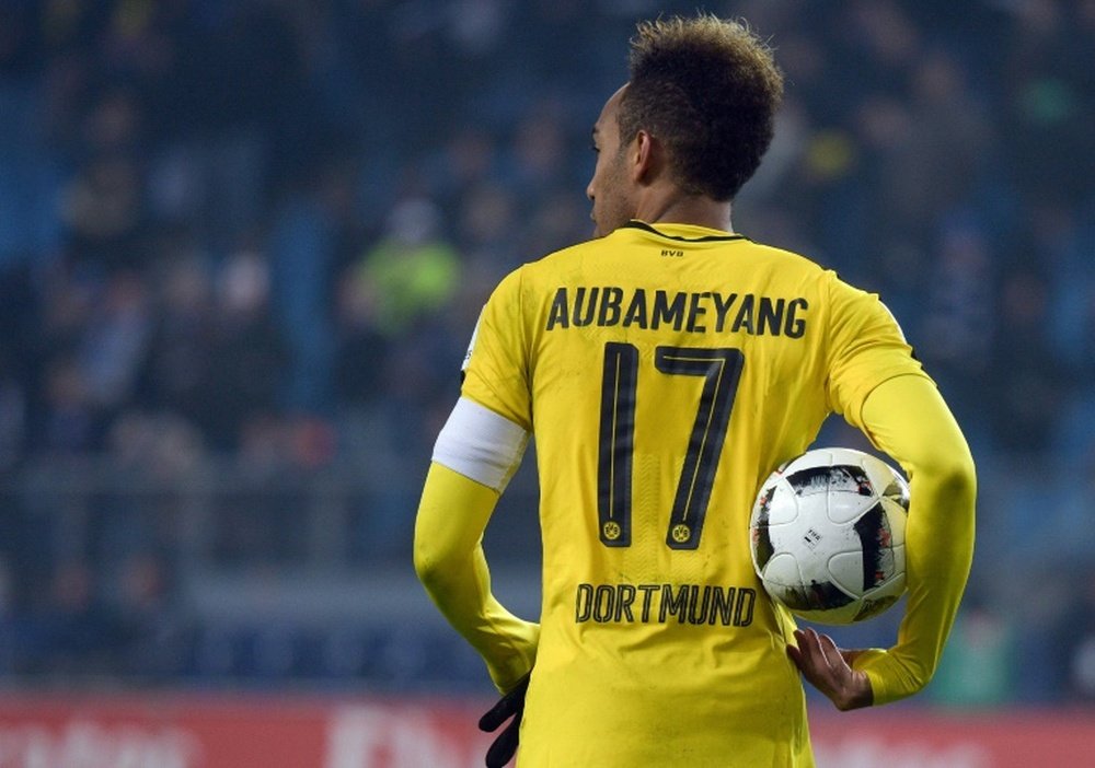 Dortmunds Pierre-Emerick Aubameyang holds the ball after scoring four times against Hamburg. AFP
