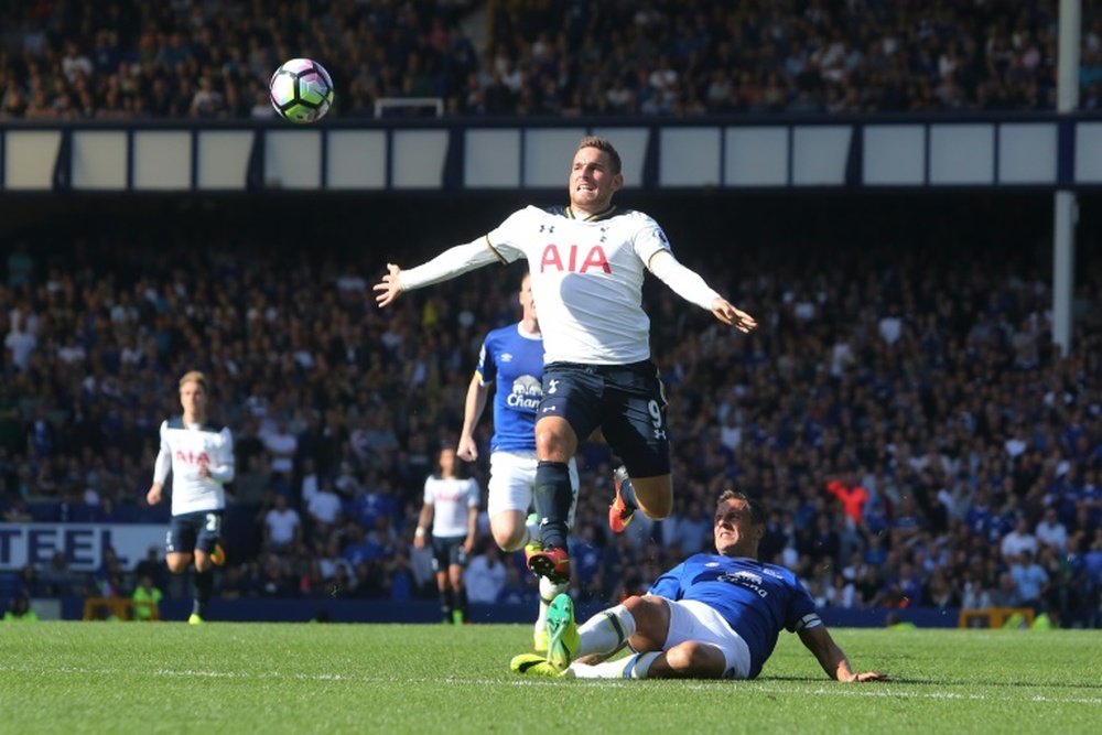 Tottenham Hotspurs Vincent Janssen (L) fights for the ball with Evertons Phil Jagielka during their English Premier League match, at Goodison Park in Liverpool, on August 13, 2016