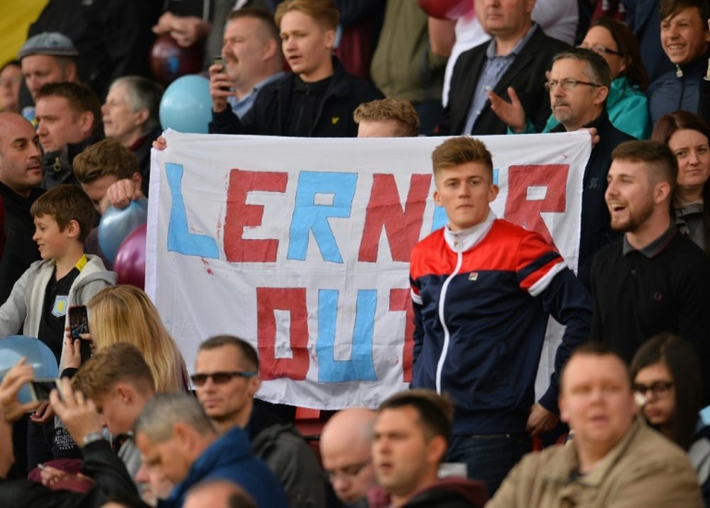 Aston Villa fans hold up a banner calling for the departure US chairman Randy Lerner during the Premier League match against Watford in April 2016