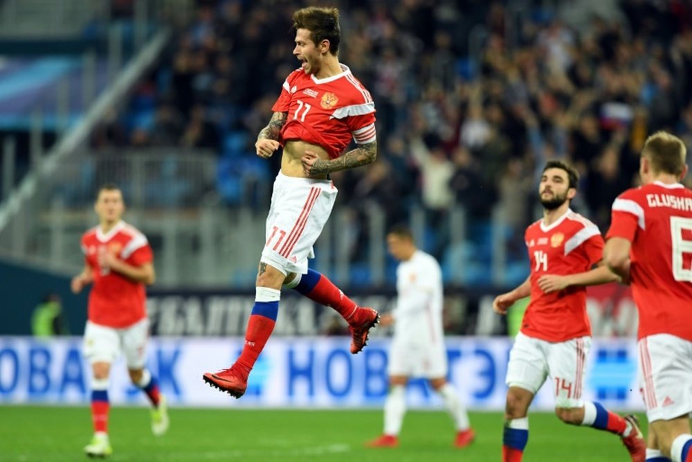 Smolov's brace earned his side a draw against Spain. AFP